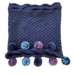 Cowl scarf beautiful color with cables and pompoms.